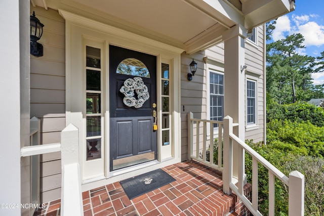 property entrance featuring a porch