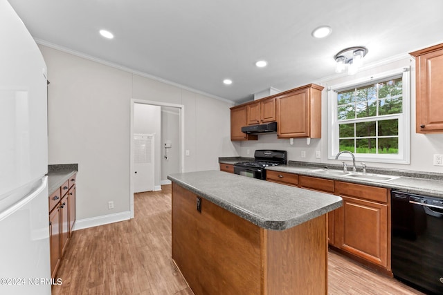 kitchen with crown molding, a sink, a kitchen island, under cabinet range hood, and black appliances