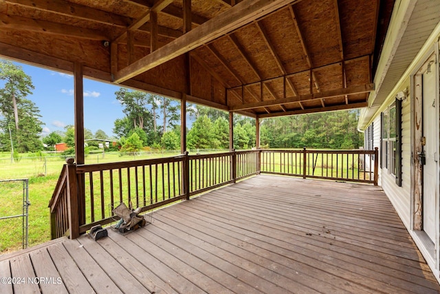 deck with a fenced backyard and a yard