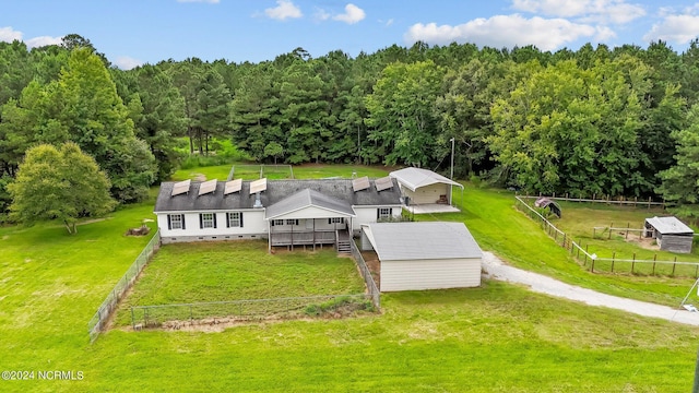 aerial view featuring a wooded view