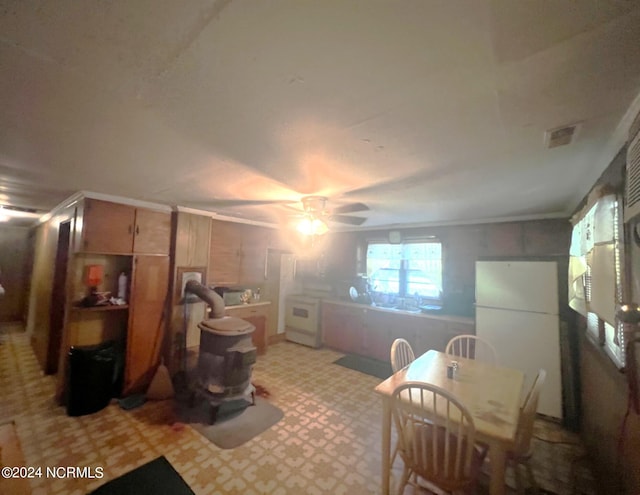 interior space featuring ceiling fan and white refrigerator