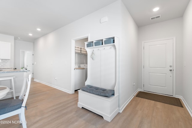 mudroom with washer / dryer and light hardwood / wood-style flooring