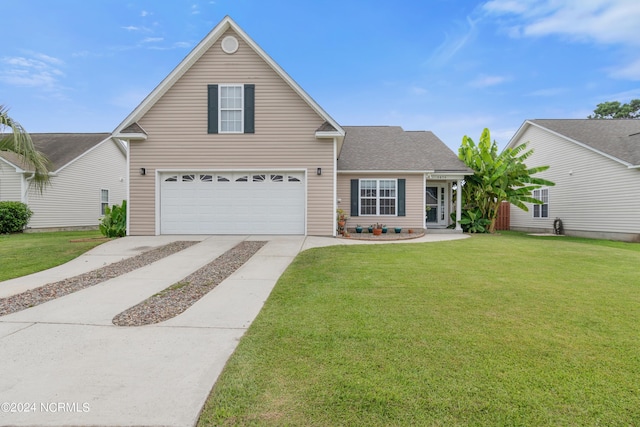 view of front property with a garage and a front yard