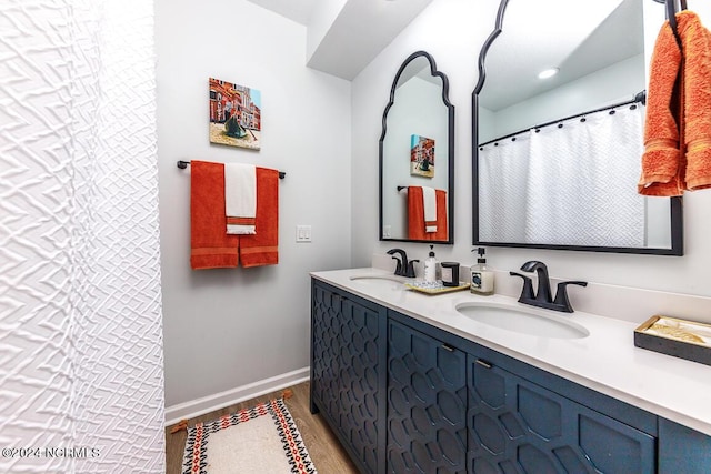 bathroom featuring wood-type flooring and vanity