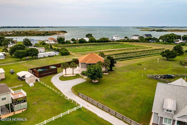 birds eye view of property with a rural view and a water view