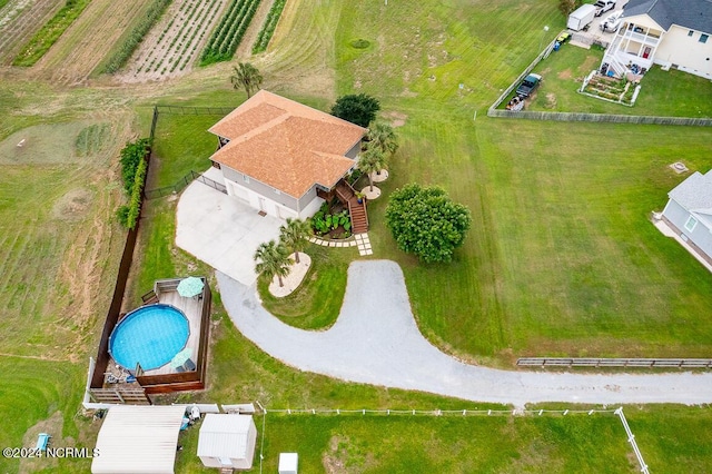 birds eye view of property with a rural view