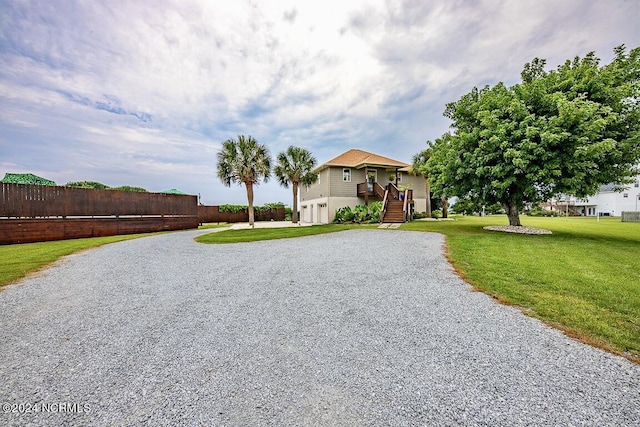 view of front facade featuring a garage and a front lawn