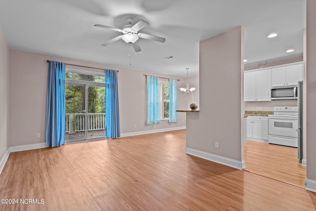 unfurnished living room with visible vents, baseboards, ceiling fan with notable chandelier, light wood-style floors, and recessed lighting