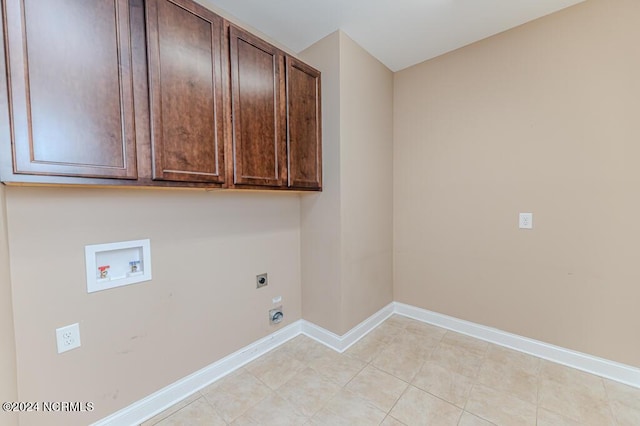 washroom featuring baseboards, hookup for a washing machine, cabinet space, and hookup for an electric dryer