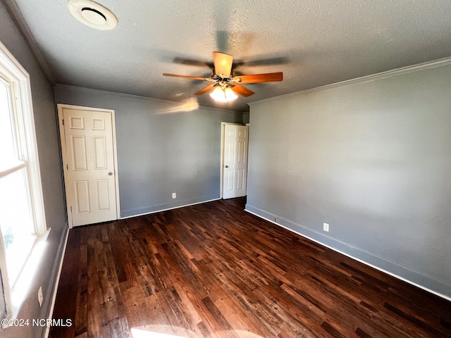 spare room featuring wood-type flooring, ornamental molding, and ceiling fan