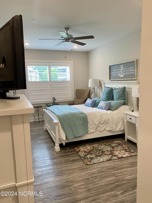 bedroom featuring dark hardwood / wood-style floors and ceiling fan