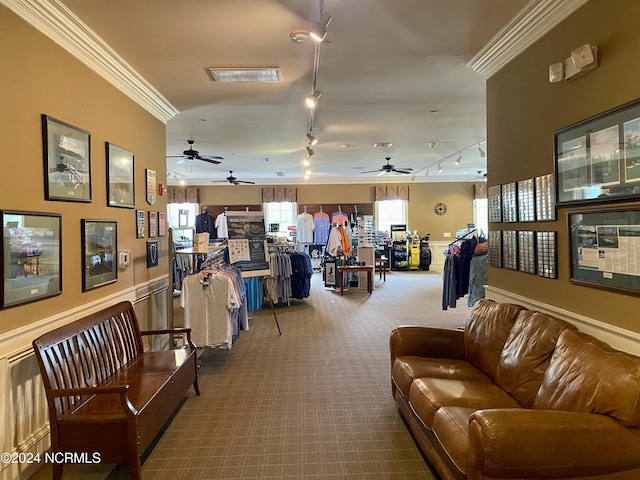 interior space featuring crown molding and rail lighting