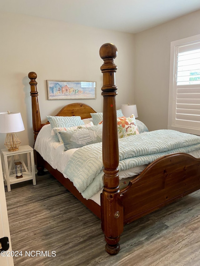 bedroom featuring dark hardwood / wood-style floors