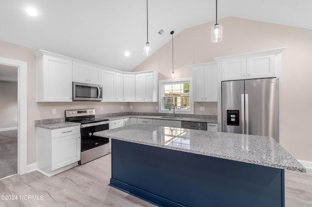 kitchen with pendant lighting, white cabinetry, sink, and appliances with stainless steel finishes