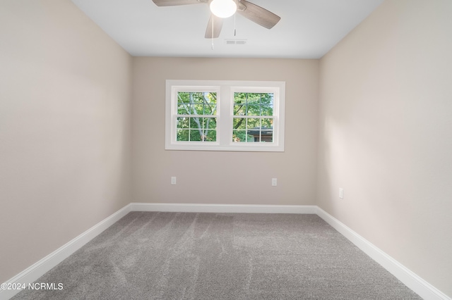 empty room featuring carpet flooring and ceiling fan