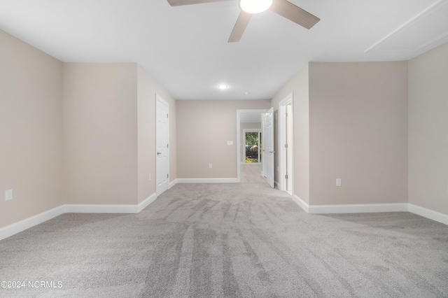 empty room with light carpet and ceiling fan