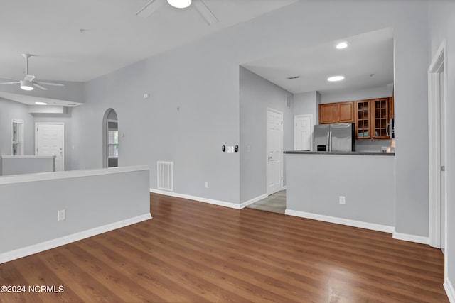 kitchen featuring ceiling fan, wood-type flooring, and stainless steel fridge