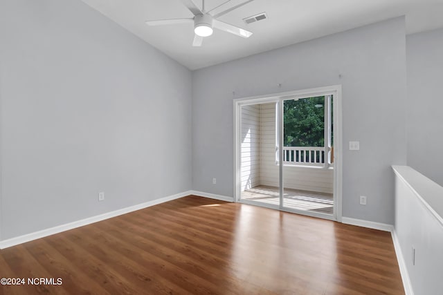 empty room with hardwood / wood-style floors and ceiling fan