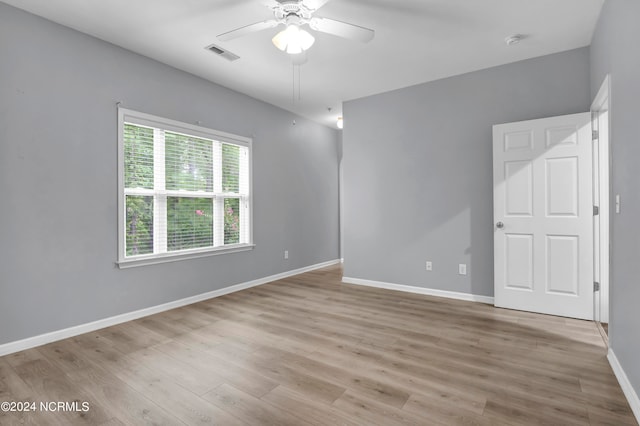 spare room with ceiling fan and light hardwood / wood-style floors