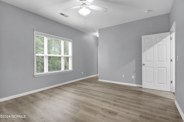 spare room featuring ceiling fan and light wood-type flooring