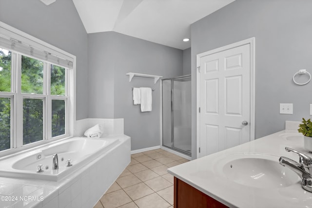 bathroom with vanity, tile patterned floors, separate shower and tub, and lofted ceiling