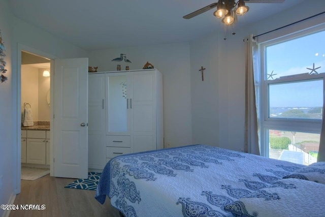 bedroom with a closet, ceiling fan, and light hardwood / wood-style flooring