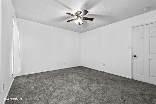 spare room featuring ceiling fan, a textured ceiling, and carpet floors