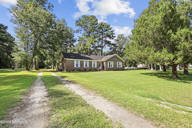 ranch-style house with a front lawn