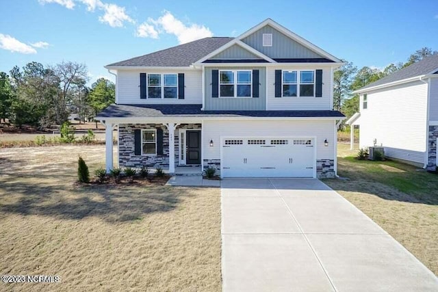 craftsman-style house with a front lawn, a garage, and cooling unit