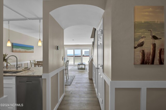 hall featuring sink and light hardwood / wood-style flooring