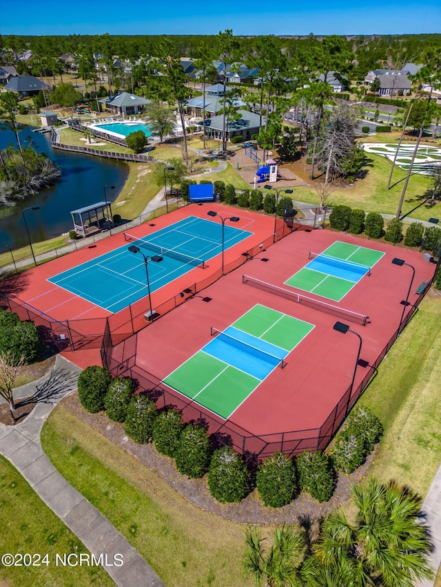 birds eye view of property with a water view