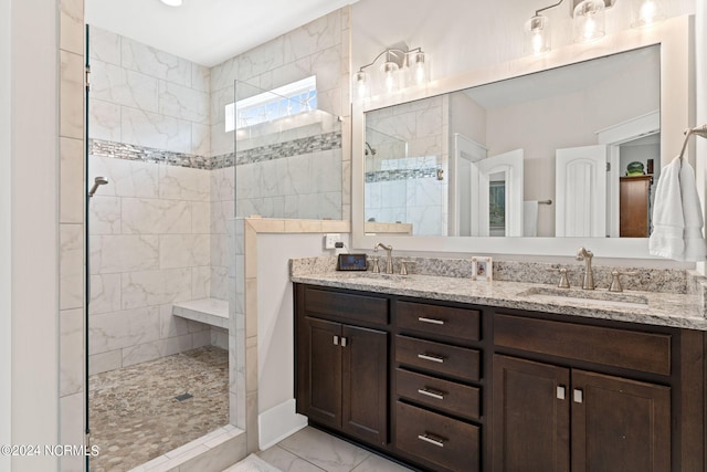 bathroom featuring vanity and a tile shower