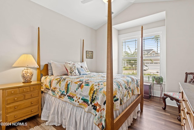 bedroom with vaulted ceiling, ceiling fan, and hardwood / wood-style floors