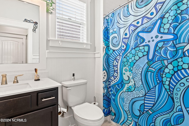 bathroom featuring vanity and toilet