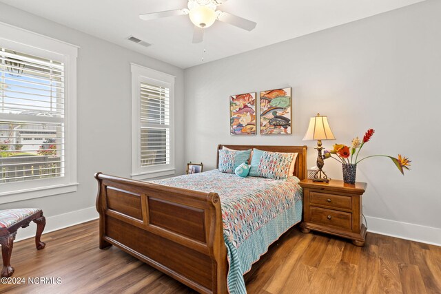 bedroom with hardwood / wood-style floors and ceiling fan