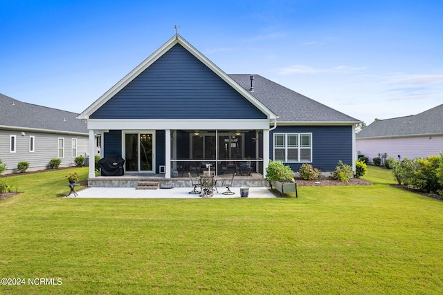 back of property featuring a patio area and a lawn