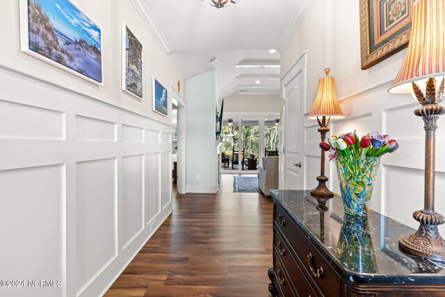 hall featuring dark hardwood / wood-style flooring and crown molding