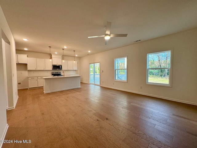 unfurnished living room with a large fireplace