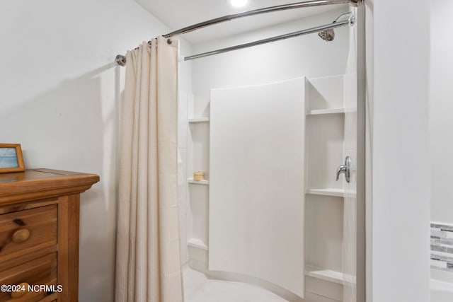 bathroom with a shower with shower curtain