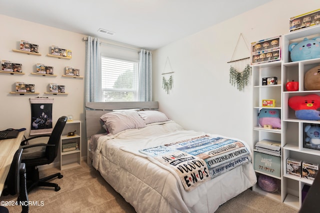 bedroom with light carpet