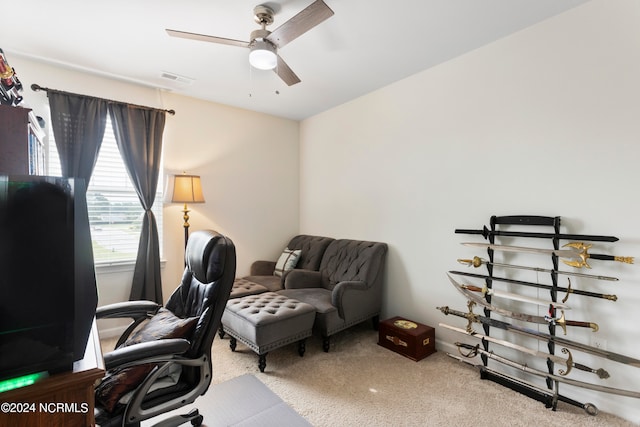 carpeted home office with ceiling fan