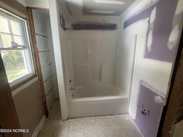 bathroom with tub / shower combination and tile patterned floors