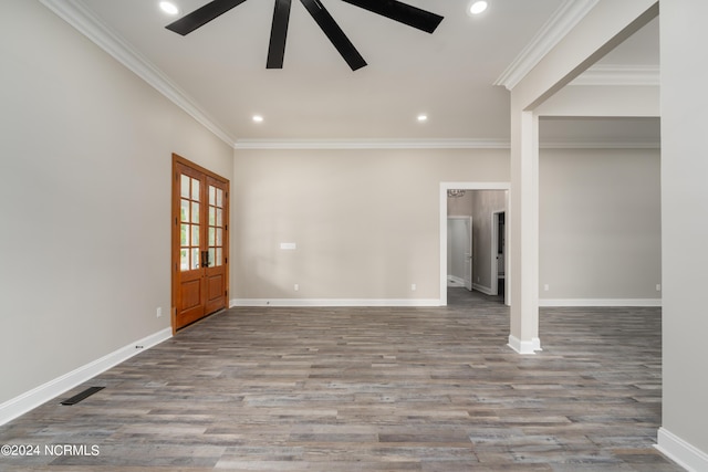 interior space featuring wood-type flooring, ceiling fan, and crown molding