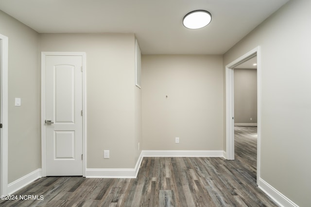 spare room featuring dark hardwood / wood-style floors