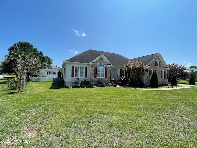 ranch-style home with a front lawn