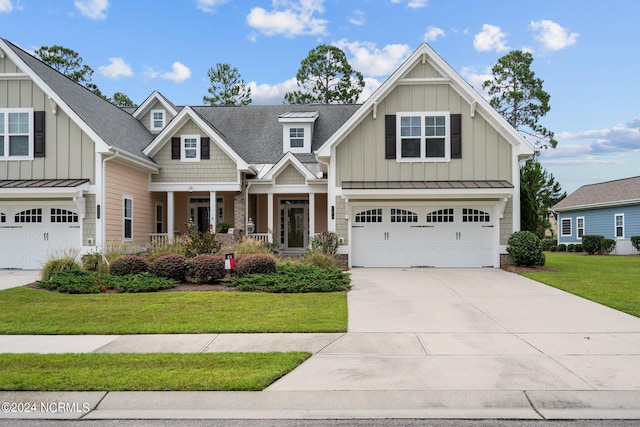 craftsman-style house with a porch, a front lawn, and a garage