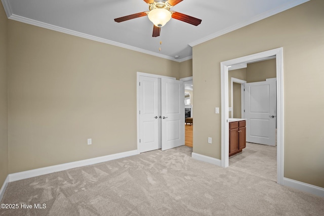 unfurnished bedroom featuring a closet, ornamental molding, light colored carpet, and ceiling fan