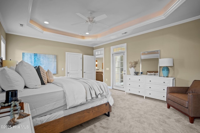 carpeted bedroom featuring a tray ceiling, ceiling fan, ornamental molding, and access to outside