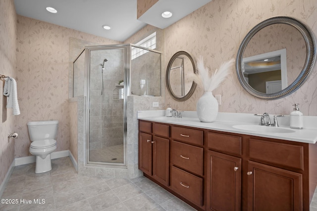 bathroom with vanity, tile patterned flooring, a shower with door, and toilet