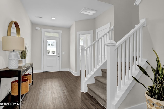 foyer entrance with dark hardwood / wood-style floors